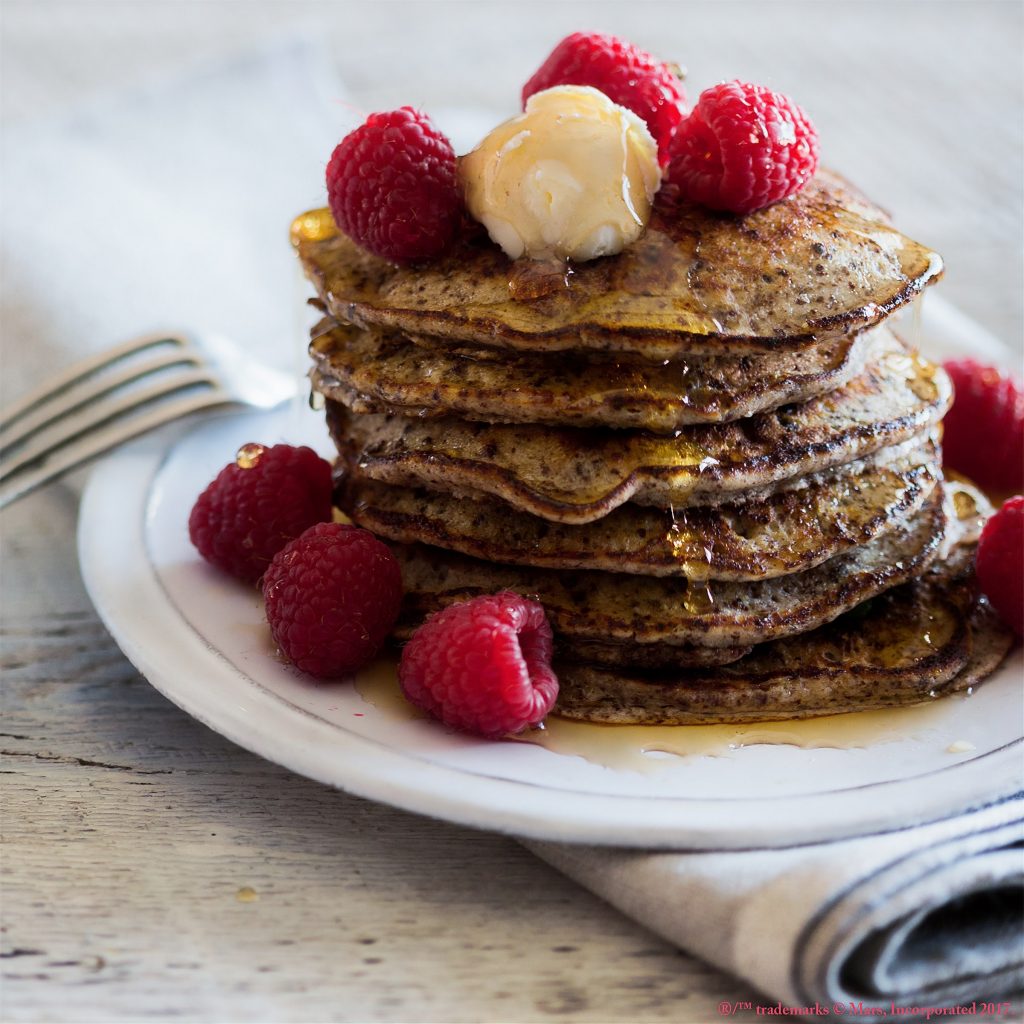 Pancakes with butter and strawberries.
