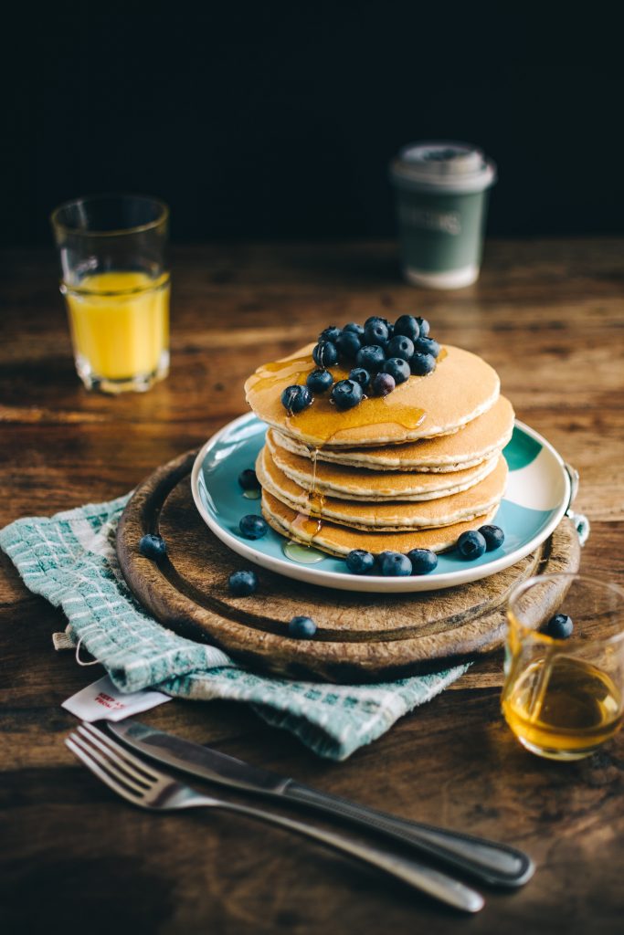 Blueberry Pancakes on wooden table.