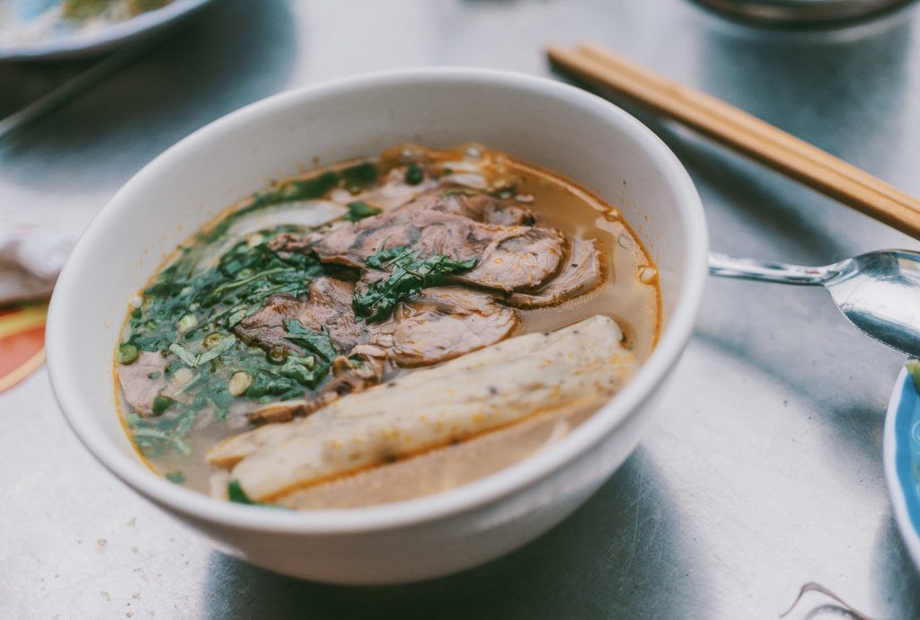 Soup with meat in white bowl
